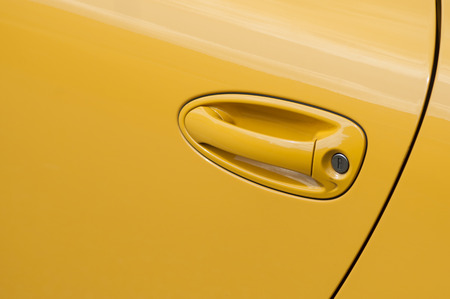 closeup of yellow handle on modern carの写真素材