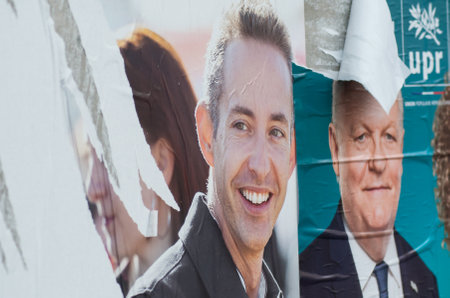 Mulhouse - France - 17 May 2019 - torn posters of political party leaders ones of the candidates running in the May 2019 european electionsのeditorial素材