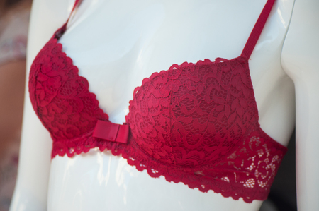 closeup of red bra on mannequin in fashion store showroom for womenの写真素材