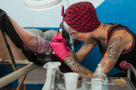 Illzach - France -9 June 2019 - Closeup of tattooing exhibition at fun car show eventのeditorial素材