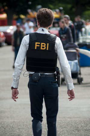 Illzach - France -9 June 2019 - Portrait of man with FBI uniform and bullet proof at fun car show...