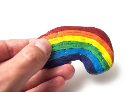 Closeup of rainbow on stone pebble on white backgroundの写真素材