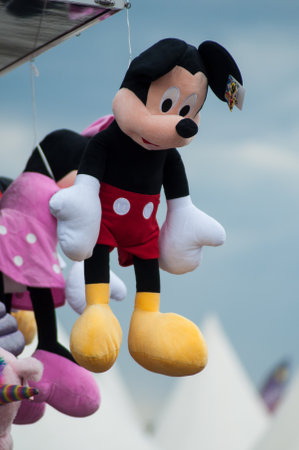 Mulhouse - France - 30 July 2019 - Closeup of Mickey Mouse plush in attraction park - Mickey is the...