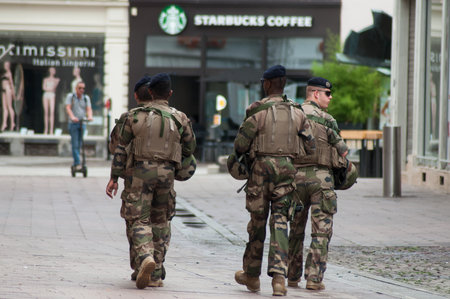 Mulhouse - France - 11 August 2019 - group of military patrolling on the pedestrian street
