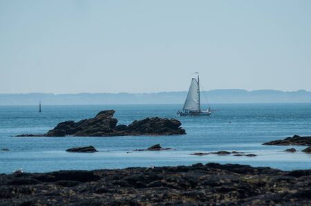 view of sailboat in atlantic ocean in wild coast in Quiberon in french britain - Morbihan  - Franceの写真素材
