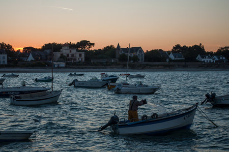 Quiberon - France - 10 July 2019 - view of harbor with boats on sunset backgroundのeditorial素材