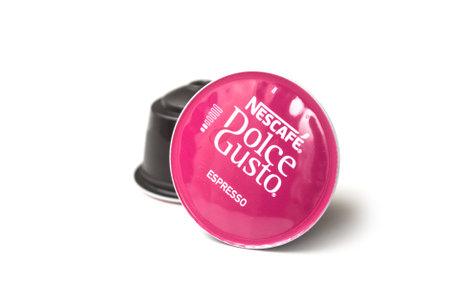 Mulhouse - France -23 August 2019 - closeup of pink Nescafe expresso capsules, the famous french brand of coffee dose on white backgroundのeditorial素材