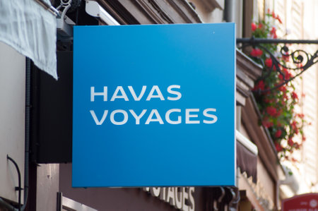 Mulhouse - France - 25 August 2019 - Closeup of Havas voyages sign on travel agency front in the streetのeditorial素材