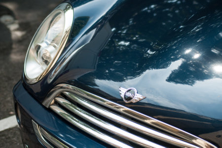 Mulhouse - France - 27 August 2019 - Closeup of Mini cooper front with logo parked in the streetのeditorial素材