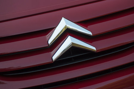 Mulhouse - France - 28 August 2019 - Closeup of Citroen logo on purple Citroen C2 front parked in the streetのeditorial素材