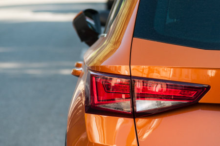 Mulhouse - France - 31 August 2019 - Closeup of rear light of orange Seat leon parked in the streetのeditorial素材