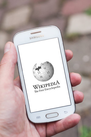 Mulhouse - France - 27 March 2018 - Closeup of Wikipedia logo on smartphone in hand in the streetのeditorial素材