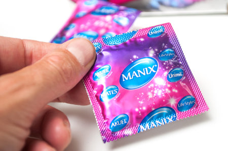 Mulhouse - France - 6 September 2019 - Closeup of Manix condoms on white backgroundのeditorial素材