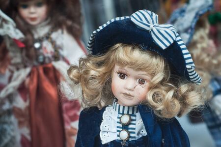 Closeup of vintage dolls at flea market in the streetの写真素材