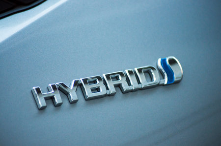 Mulhouse - France - 11 September 2019 - Closeup of Hybrid sign on blue toyota car parked in the streetのeditorial素材