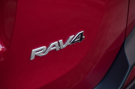 Mulhouse - France - 11 September 2019 - Closeup of Toyota rav4 logo on red car parked in the street