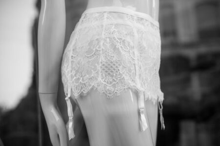 closeup of white Suspender belt underwear on mannequin in fashion store for womenの写真素材