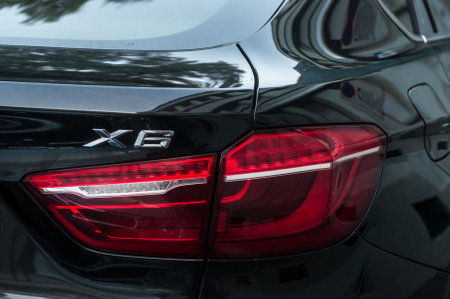 Mulhouse - France - 15 September 2019 - Closeup of rear light and sign on black bmw X6 parked in the streetのeditorial素材