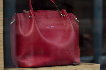 Mulhouse - France - 15 September 2019 - Closeup of red leather luxury bag in Lancaster store showroomのeditorial素材