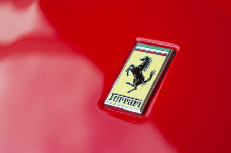Mulhouse - France - 5 October 2019 - Closeup of Ferrari logo on red sport car in ferrari retailer showroomのeditorial素材