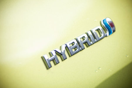 Mulhouse - France - 9 October 2019 - Closeup of Hybrid sign on yellow toyota carのeditorial素材