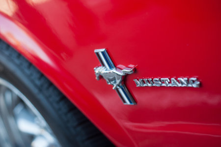Mulhouse - France - 13 October 2019 - Closeup of logo on red ford mustang door parked in the street