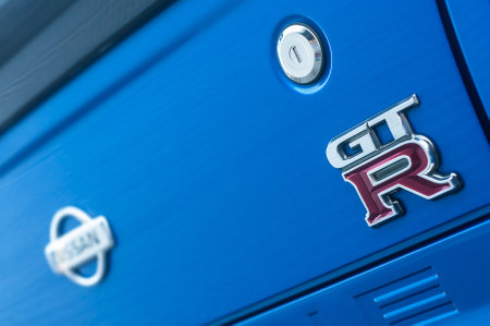 Mulhouse - France - 13 October 2019 - Closeup of GT R sign on blue Nissan Skyline parked in the...