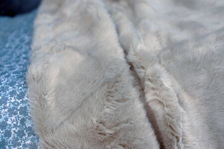 closeup of fluffy plaid on thebed in a decoration sotre showroom