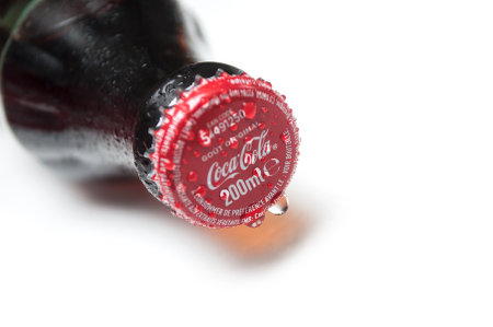 Mulhouse - France - 24 October 2019 - Closeup of drops of water on Cocacola bottle on white backgroundのeditorial素材