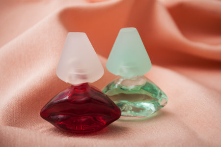 Mulhouse - France - 13 November 2019 - Closeup of Salvator Dali perfume in transparent bottles in shaped mouth on satin backgroundのeditorial素材