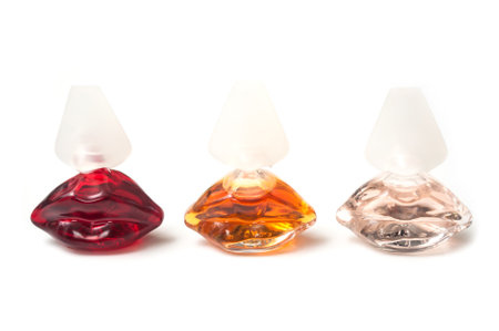 Mulhouse - France - 13 November 2019 - Closeup of Salvator Dali perfume in transparent bottles in shaped mouth on white backgroundのeditorial素材