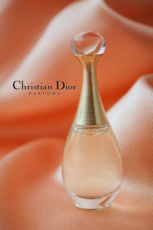 Mulhouse - France - 15 November 2019 - Closeup of Dior perfume from Christian Dior in a miniature bottle on satin backgroundのeditorial素材