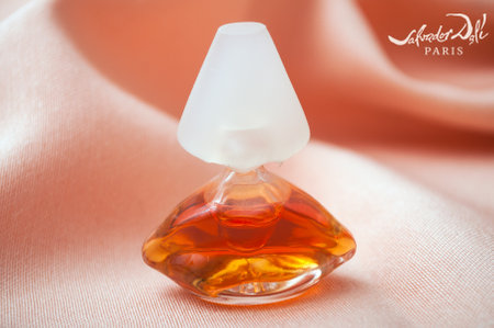 Mulhouse - France - 13 November 2019 - Closeup of Salvator Dali perfume in two transparent bottle in shaped mouth on satin backgroundのeditorial素材