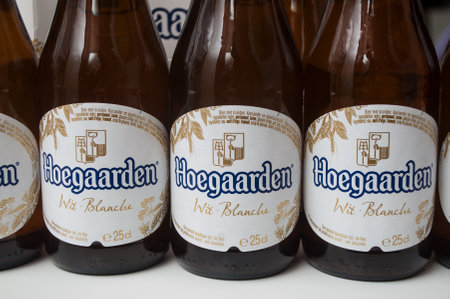 Mulhouse - France - 25 November 2019 - Closeup of the famous belgian Hoegaarden bottles of white bier on white backgroundのeditorial素材