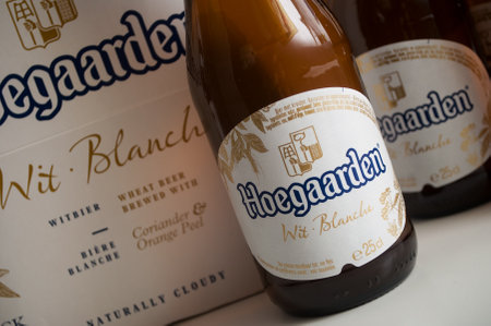 Mulhouse - France - 25 November 2019 - Closeup of the famous belgian Hoegaarden bottles of white bier on white backgroundのeditorial素材