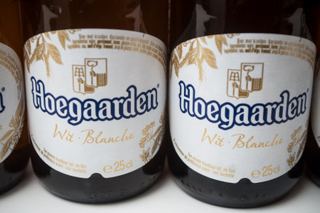 Mulhouse - France - 25 November 2019 - Closeup of the famous belgian Hoegaarden bottles of white bier on white backgroundのeditorial素材