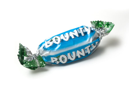 Mulhouse - France - 26 November 2019 - Closeup of Bounty coconut chocolate bar by Mars compagny in blue packaging on white backgroundのeditorial素材