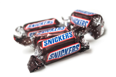 Mulhouse - France - 26 November 2019 - Closeup of Snickers chocolate bar by Mars compagny in brown...