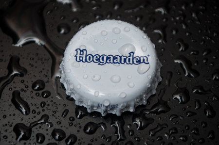 Mulhouse - France - 30 November 2019 - Closeup of  drops of water on metallic cap of bier by Hoegaarden brand on black backgroundのeditorial素材