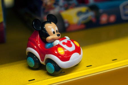 Mulhouse - France - 7 December 2019 - Closeup of mickey mouse character in plastic car in a toy store supermarketのeditorial素材