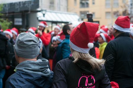 Mulhouse - France - 15 December 2019 - Portrait of people standing in the street with christmas hats on head before the christmas runningのeditorial素材