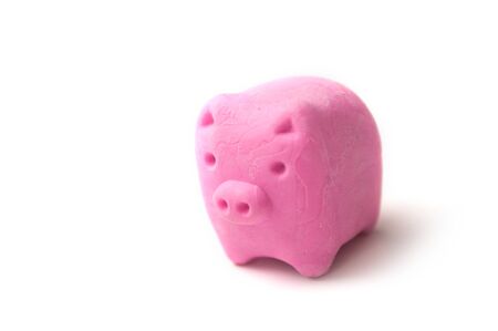 Closeup of pink erase in shaped piggy bank - debt erasing conceptの写真素材