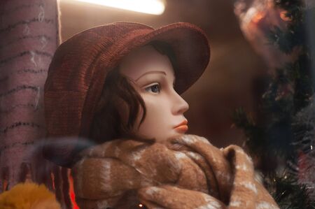 closeup of woolen hat ands scarf  on mannequin in a fashion store showroomの写真素材