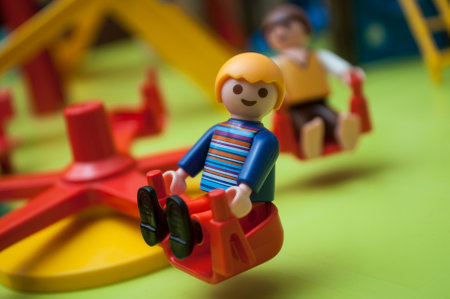 Mulhouse - France - 26 December 2019 - Closeup of Playmobil figurines at playground for children on green backgroundのeditorial素材