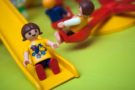Mulhouse - France - 26 December 2019 - Closeup of Playmobil figurines at playground for children on green backgroundのeditorial素材