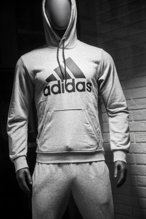 Mulhouse - France - 29 December 2019 - Closeup of Grey sweatsuit by Adidas on mannequin in fashion...