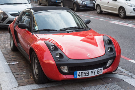 Mulhouse - France - 31 December 2019 - Front view of orange Smart roadster parked in the street