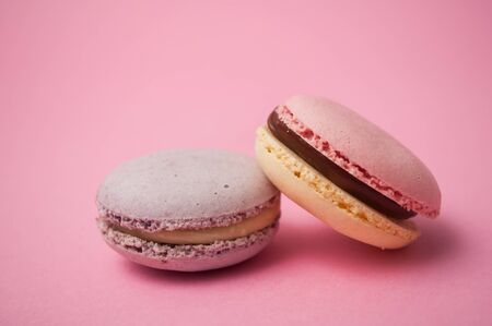Closeup of french macarons on pink background の写真素材
