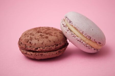 Closeup of french macarons on pink background 