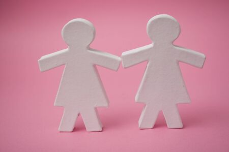 Closeup of two grils on pink background - Lesbian love conceptの写真素材